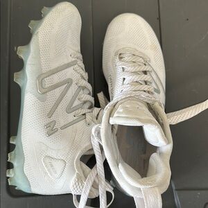 White and Gray New balance Sports Cleats